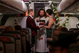 Married on a Play plane en route to Paris